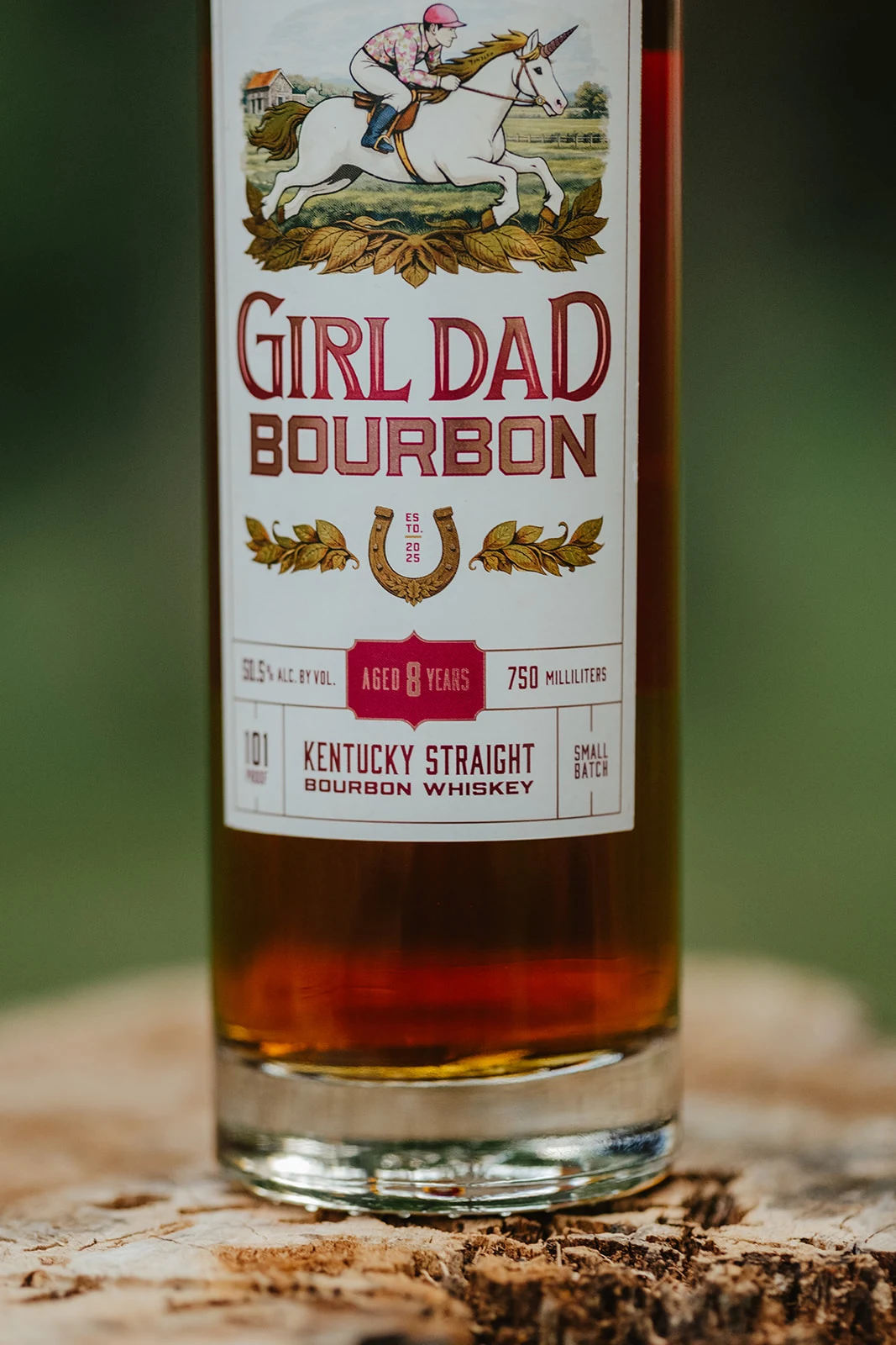 Close-up of the Girl Dad Bourbon label showing aged 8 years and Kentucky straight bourbon whiskey
